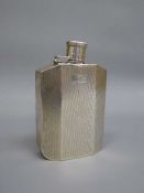 A silver hip flask, 186g, hinged lid a/f CONDITION REPORT: Cap needs re-pinning.