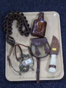 A tray containing ammunition belts, tooled leather cased flask, knife in sheath, sporran,