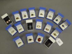 A quantity of silver rings and a pair of mabe pearl earrings.