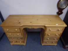 A pine pedestal desk