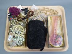 A tray of costume jewellery - bangle, evening bag,