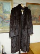 A lady's 3/4 length fur coat retailed by Marcus of Edinburgh