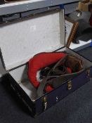 A mid 20th century trunk containing shire horse collar and tack