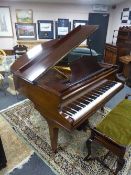 A Challen baby grand piano in mahogany case