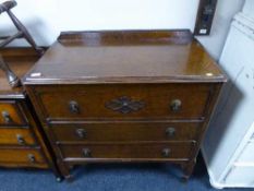 An early 20th century oak three drawer chest