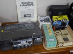 A Panasonic R-3100 receiver and a tray of Eagle multi meter, telegraph key, binoculars,