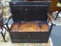 A 17th century oak box settle,