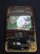 A vintage leather case of card games and dice,