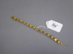 A late Victorian plaited gold bracelet, apparently unmarked, tested as 15ct, 10.4g.
