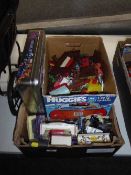 A box of assorted plastic soldiers, die cast cars,