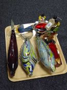 Three glass fish ornaments, two Murano glass clowns,