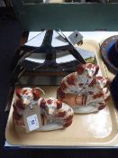 A tray of two stained leaded light shades and a pair of Staffordshire spaniels