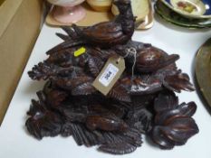 A heavily carved walnut table box depicting a family of pheasants being stalked by a fox