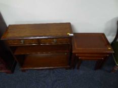 A set of mahogany open shelves and a nest of tables