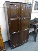 An Edwardian oak hall wardrobe