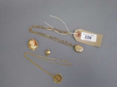 A Victorian gilt metal locket on chain, together with a 9ct gold mounted cameo brooch,