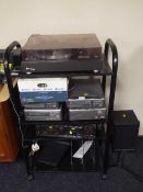 A contemporary trolley containing trio turn table, Denon four piece separate system,