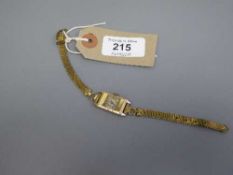An early twentieth century Swiss Lady's wrist watch with 9ct gold case and gilt metal mesh strap