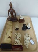 A tray of six various carved figures,