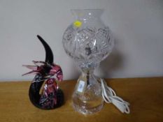 A cut glass table lamp and a decorative glass bird ornament
