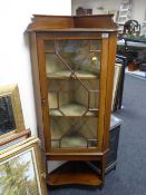 A Victorian inlaid mahogany corner cabinet