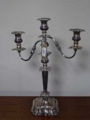 A three-way plated candelabrum,