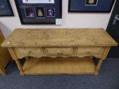 A Victorian style pine side table