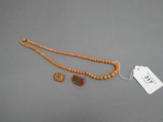 A coral bead necklace,