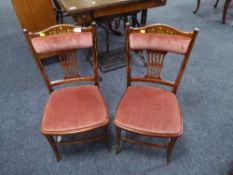A pair of late Victorian inlaid mahogany bedroom chairs