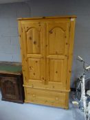 A pine child's wardrobe fitted a drawer