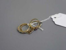 Three diamond set rings together with one further gold ring.