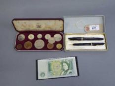 A cased Waterman's pen set together with 1953 Royal Mint coin set in case and a £1 note.