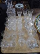 A tray of lead crystal decanter and assorted crystal glasses