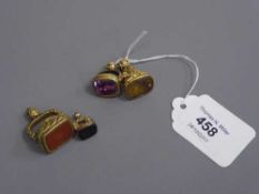 Two gold antique hardstone fobs together with two further similar examples (4)
