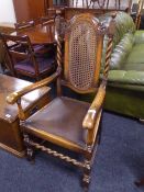 A pair of oak barley twist carver armchairs