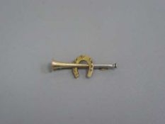 A two-tone gold hunting horn bar brooch mounted with a horseshoe
