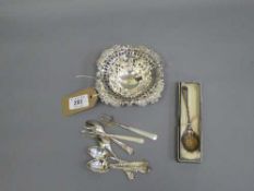 A silver pierced dish, together with six silver teaspoons, two silver pickle forks and silver spoon.
