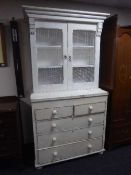 A painted double door kitchen cabinet fitted five drawers