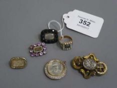 A collection of six items of nineteenth century mourning jewellery , some set in gold.