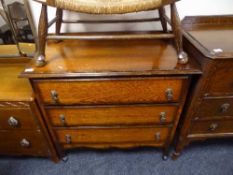 An early 20th century oak three drawer chest
