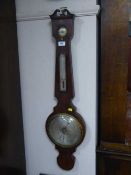 A Victorian mahogany barometer with silvered dial
