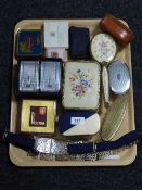 A tray of assorted hand brushes, letter opener, silver plated belt,