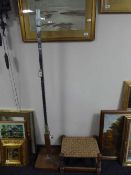 A walnut and chrome art deco style standard lamp together with an oak rush seated stool