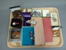 A tray of costume jewellery - jockey brooch, wrist watch, compact,