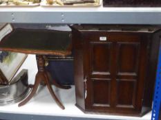A late Victorian oak hanging corner cabinet and a folding leather topped table