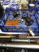 A basket of fishing equipment : reels, lead weights,