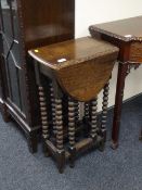 An oak gate leg table on bobbin legs
