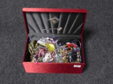 A large quantity of assorted costume jewellery and badges