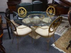 A contemporary Dansk glass topped table and four chairs with star motif decoration.