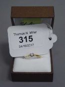 A 14ct gold diamond solitaire ring, 0.